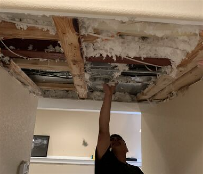 Ceiling damage caused by a water leak from heavy rain