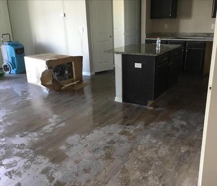 Water damage to the floor of a kitchen