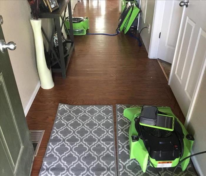 Water damage on the floor of a hallway