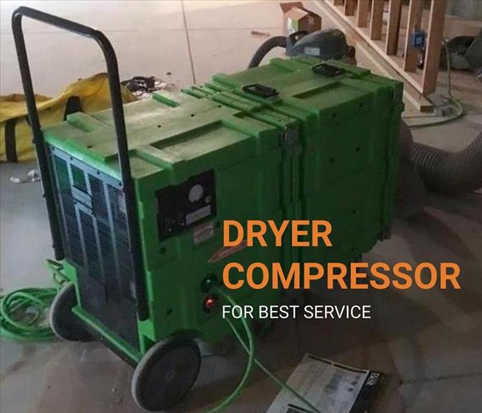big air dryer compressor on a concrete floor 